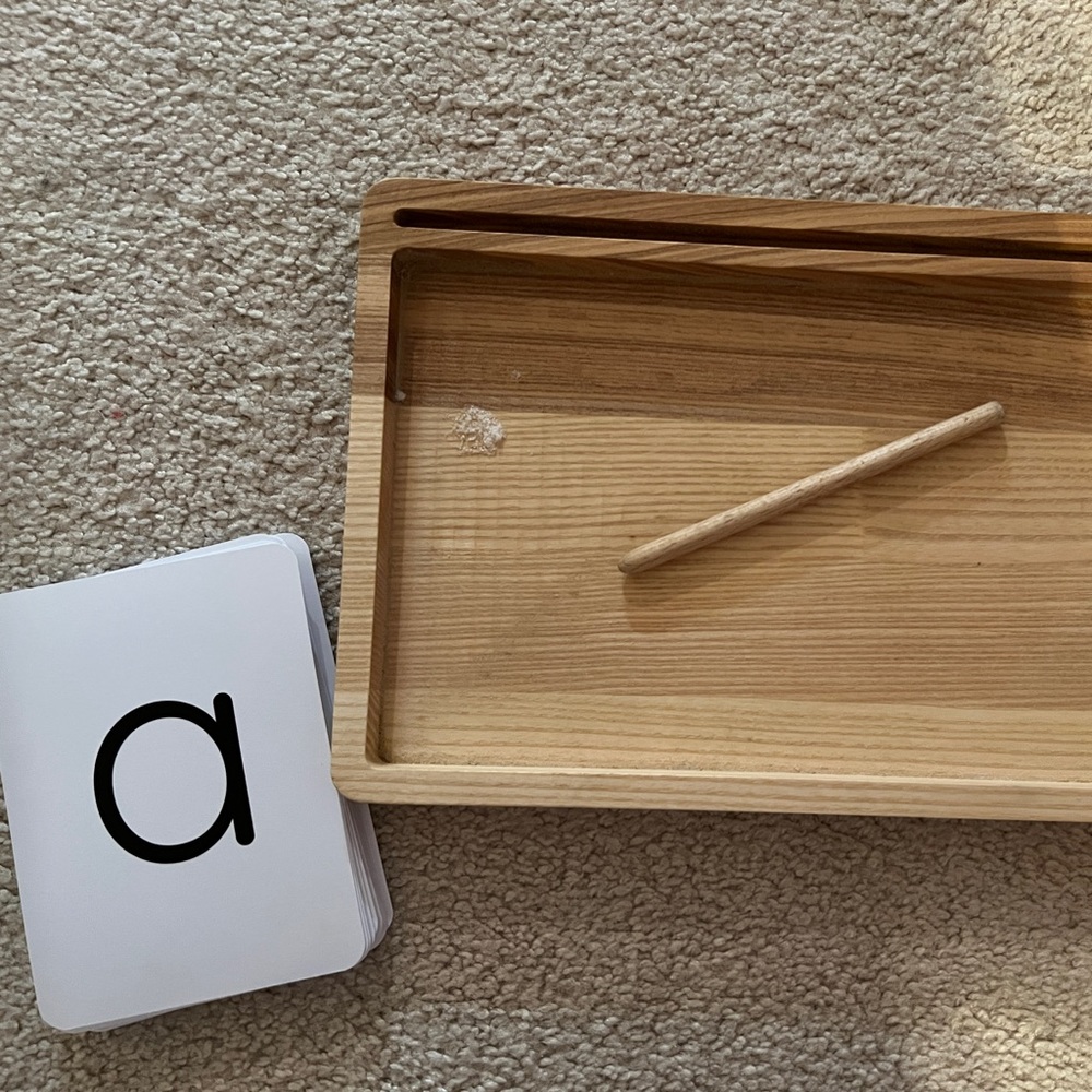 Salt tray and writing stick. Uppercase and lowercase alphabet flash cards.